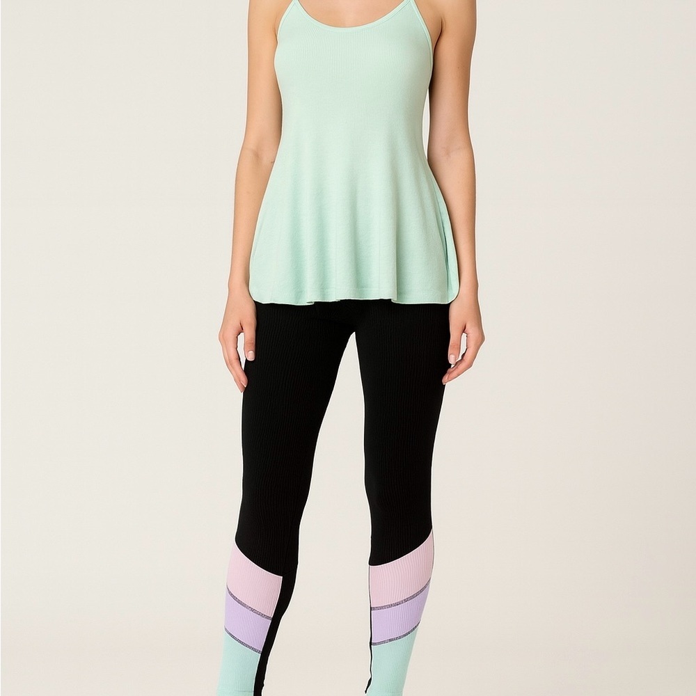 Brand new with tags we The Free tank paired with Preowned Beach Riot Leggings